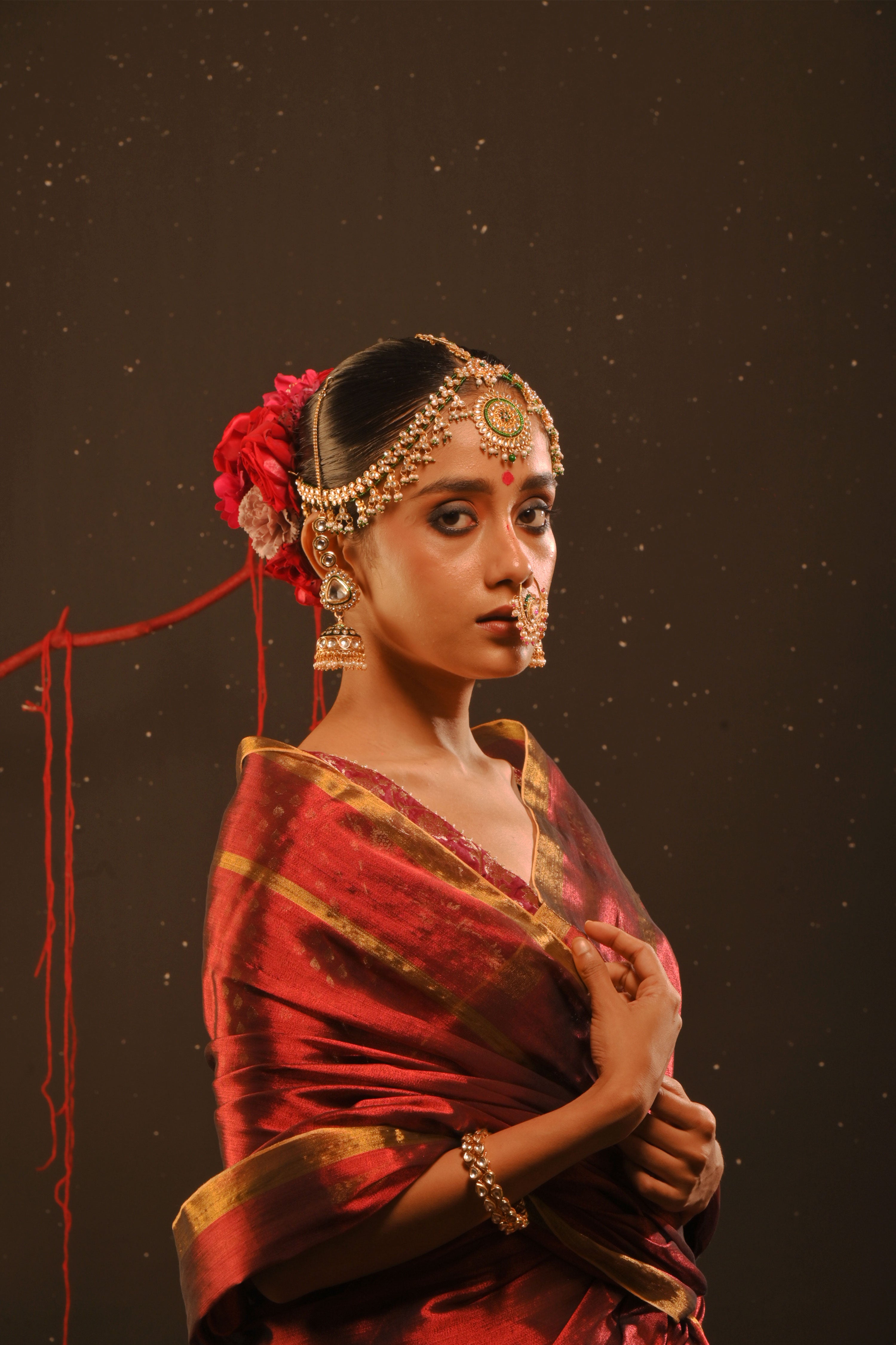 Daivika I Red handwoven tissue saree with gold striped border