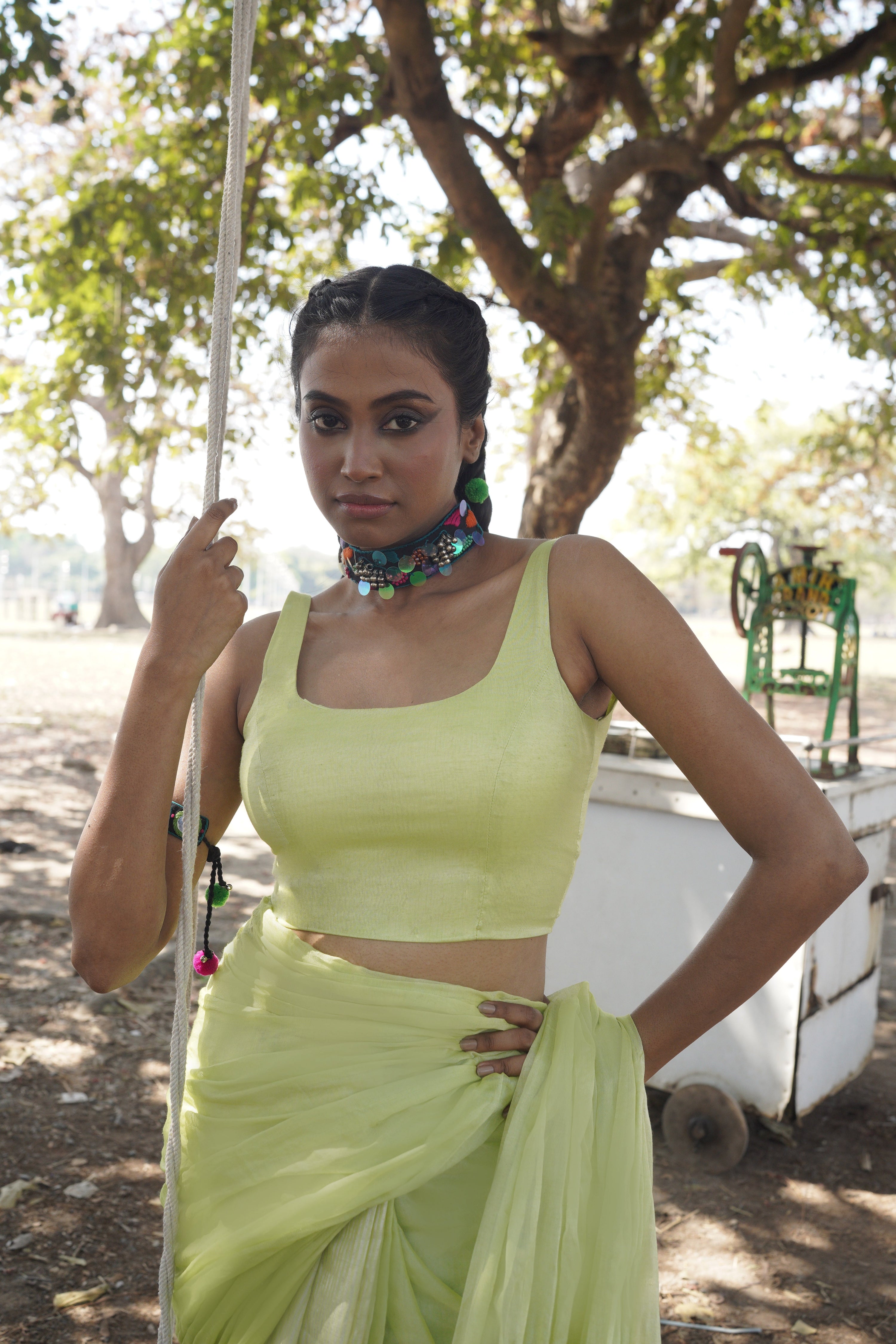 green-sleeveless-blouse