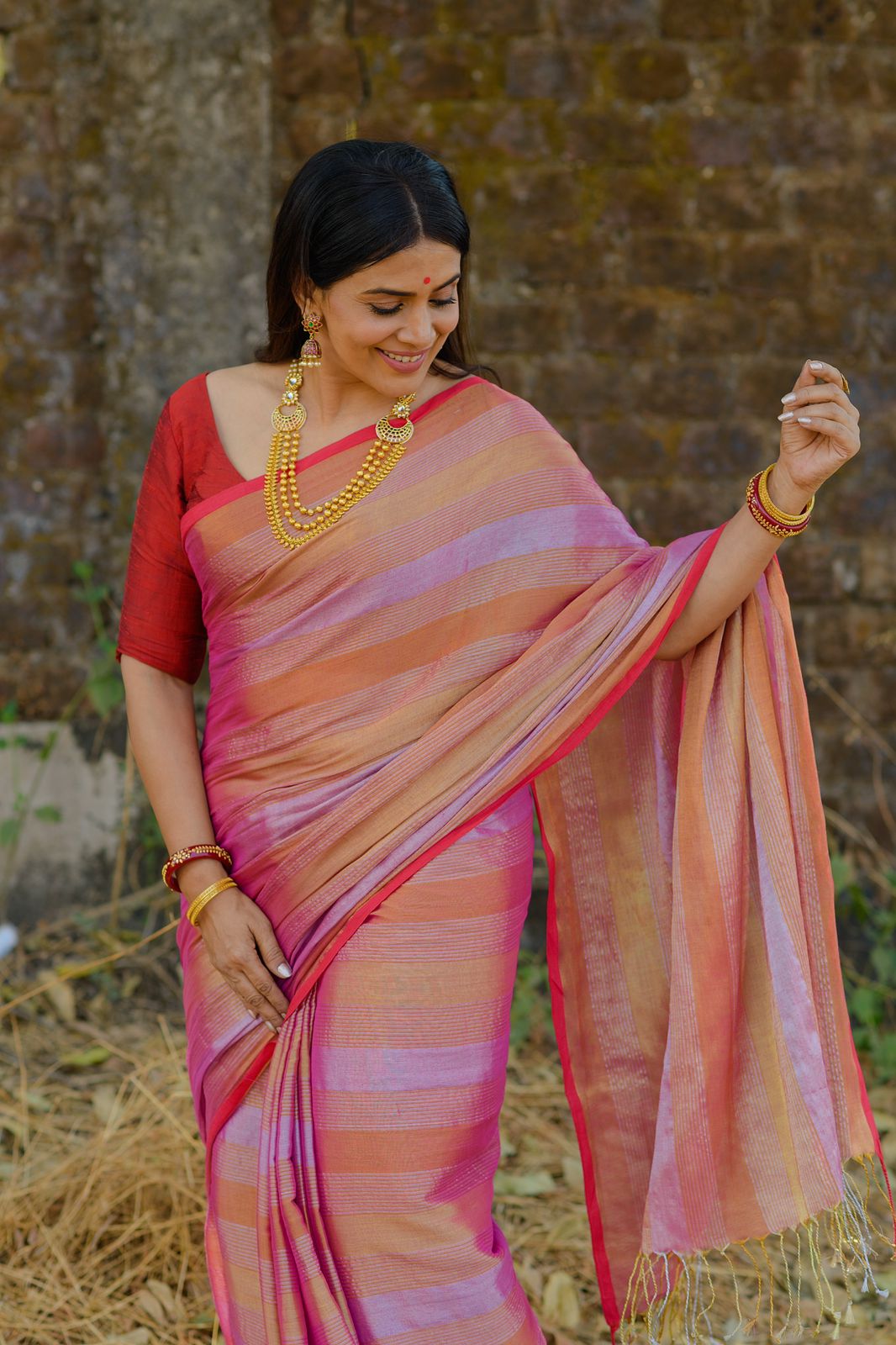 Actress Sonali Kulkarni in our Peach crown jewel Tissue saree