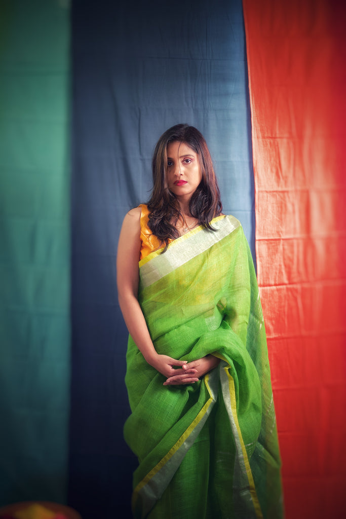 Green linen saree with zari border