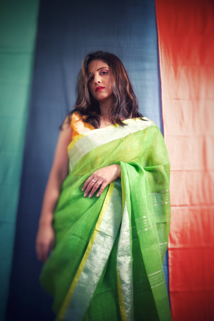Green linen saree with zari border
